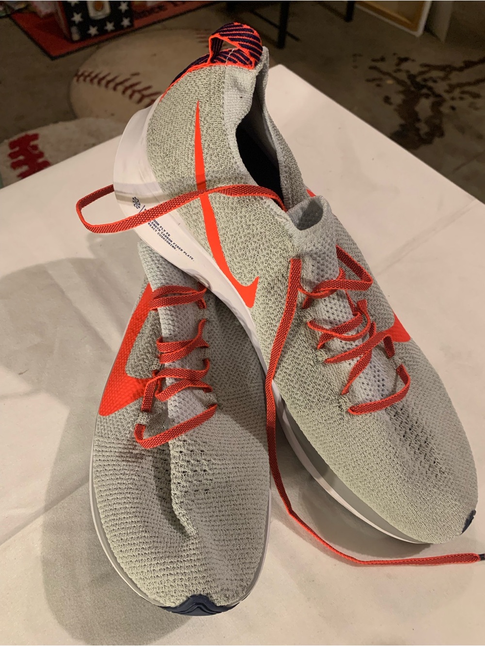 Nike Zoom Fly Running Shoes in Light Gray with Bright Orange Accents